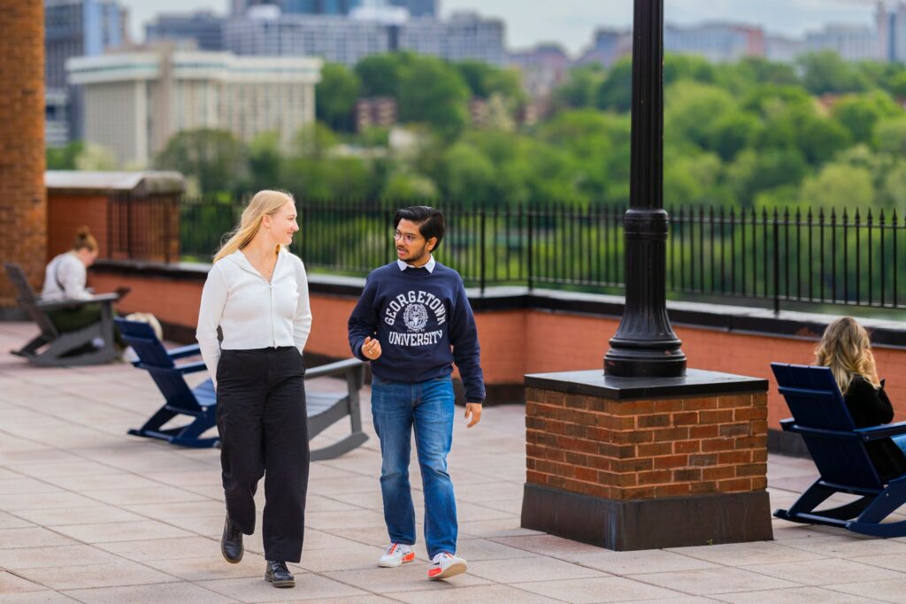 students walking and talking outside of the graduate school